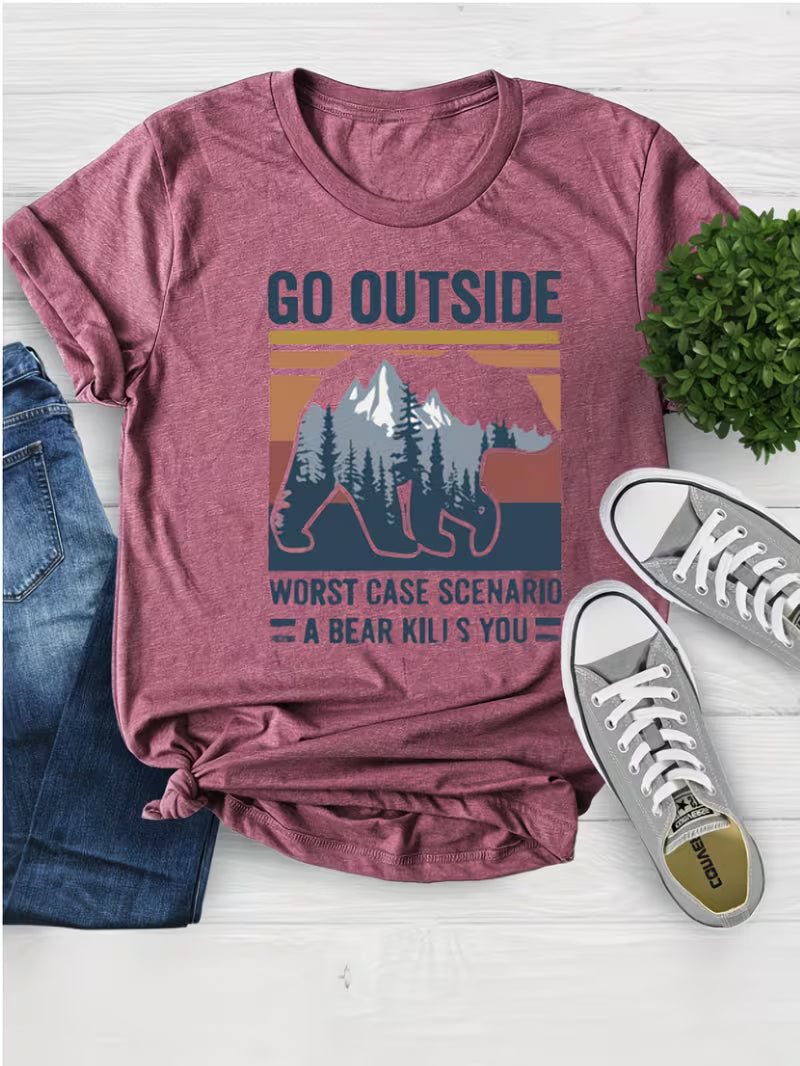 Maroon t-shirt with bear graphic and text, paired with jeans and sneakers on a light wooden surface.