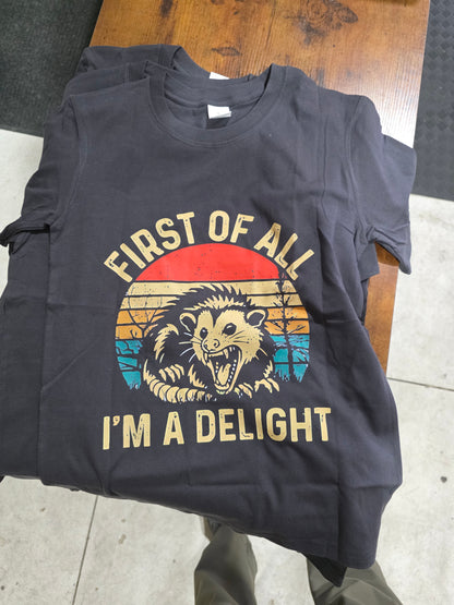 Black hoodie with graphic design and text on a wooden surface