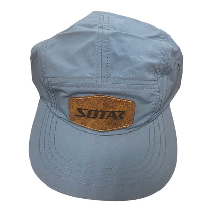 SOTAR five-panel performance hat in light blue nylon with a textured brown faux-leather logo patch on the front